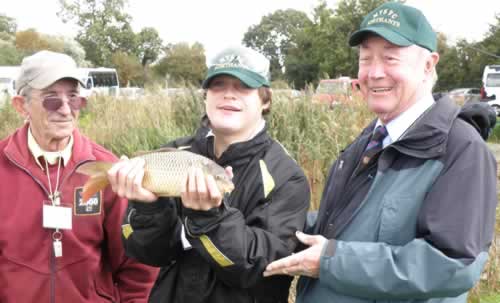 PGM, RWBro Barrie Hall celebrates a fisherman's big catch