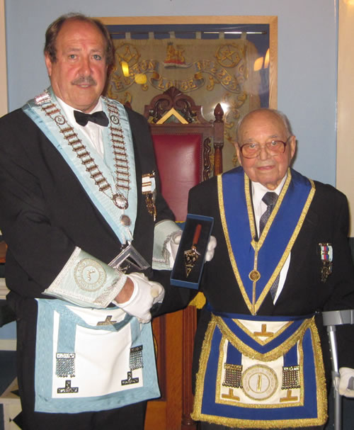 WBro Bob Barnes Presents the Trowel to WBro Harry Eddy