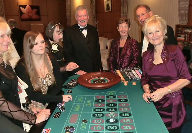 PGTreas,WBro David Watson (centre) and APGM, WBro Norman Pope, with their wives